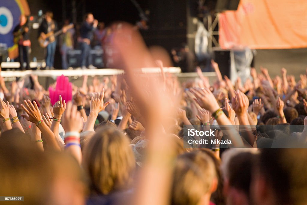 rock concert hands up in a open air rock festival Adolescence Stock Photo