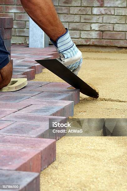 Block Paving Being Layed Stock Photo - Download Image Now - In A Row, Construction Industry, Protective Glove