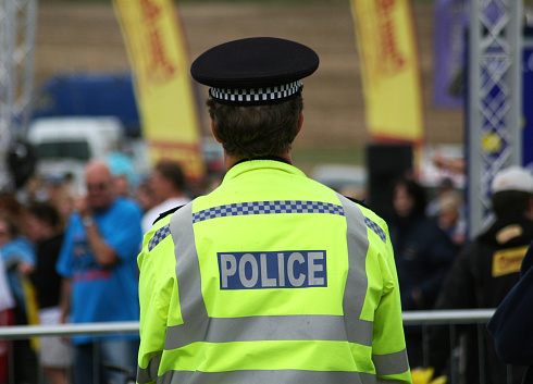 London, England, UK - 27 June 2023: Two police officers of the Metropolitan Police on patrol in central London.