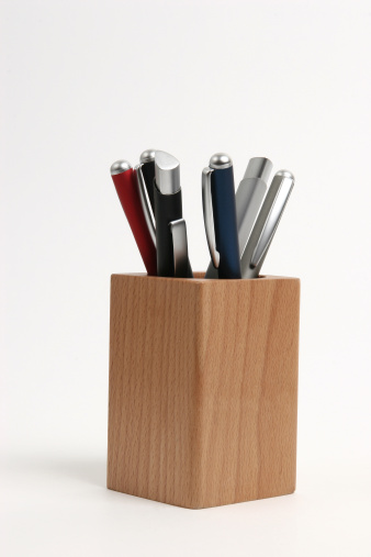 pencils in a wooden holder
