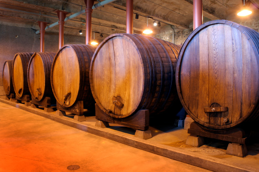 Moselsteig close to Ellenz-Poltersdorf with panoramic landscape, vinyards and a bench in front of a big wooden barrel, Germany