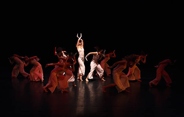 istock Group of contemporary dancers performing on stage 157186439