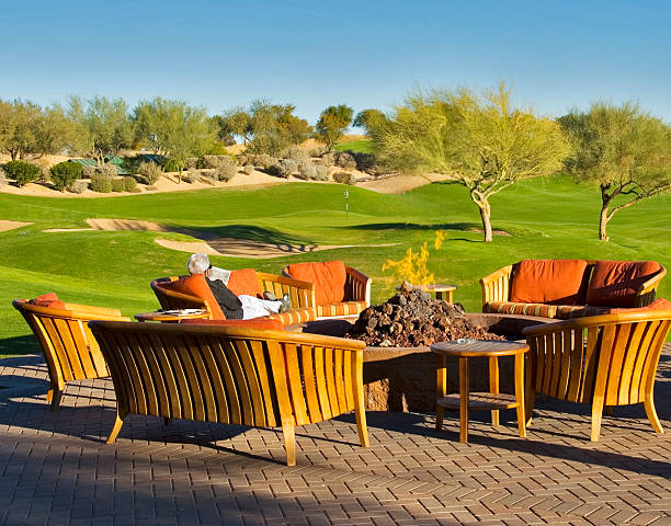 Relaxing by the Fire Pit Relaxing by the Fire Pit Overlooking a Golf Course in Scottsdale Arizona scottsdale arizona stock pictures, royalty-free photos & images