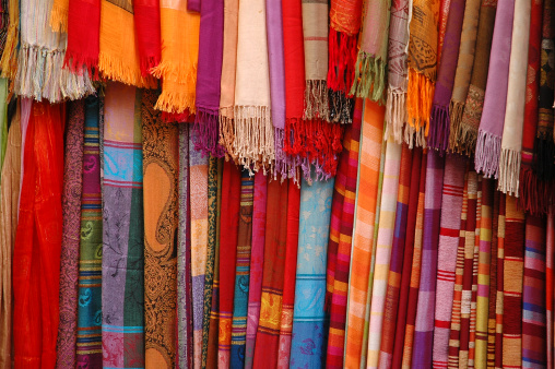 Madras is a brightly coloured cotton weft fabric with checks or stripes, often worn by Creole populations.