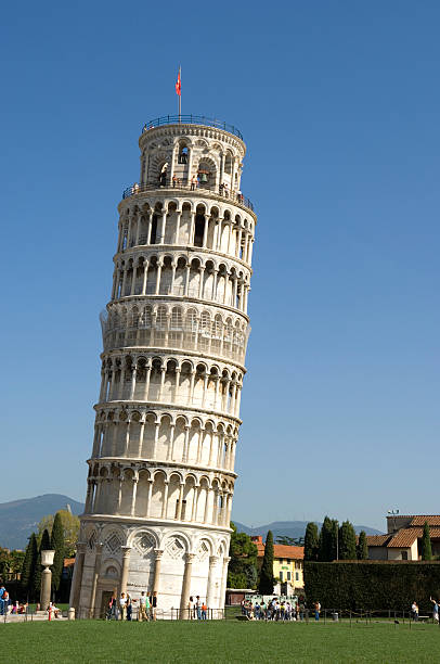 Leaning Tower of Pisa with a flag on top stock photo