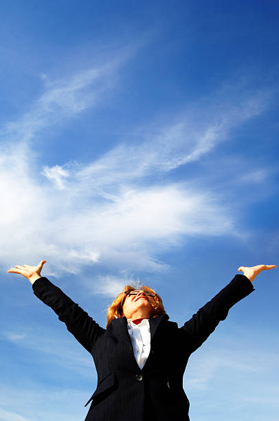 istock Woman blue sky, with some white clouds. 157186987