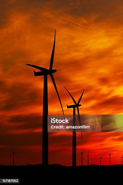 Wind Turbines Against Red And Orange Sunset Stock Photo - Download Image Now - Cirrus, Color Image, Electricity