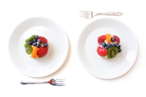 Two White Dessert Plates with fruit tarts