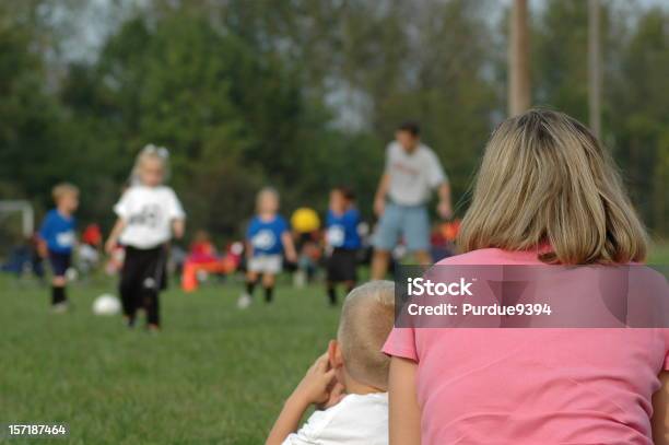 Soccer Mom And Brother Watching Sister Play Game Stock Photo - Download Image Now - Spectator, Soccer Mom, Watching