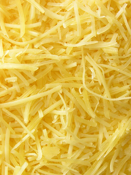 Grated cheese background Recently grated parmesan cheese grated stock pictures, royalty-free photos & images
