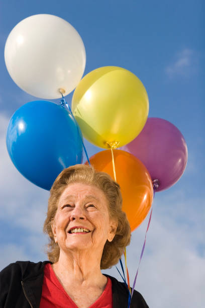 istock Woman with balloons 157188016