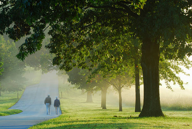 People walking at Valley Forge National Park in a foggy morning at Sunrise