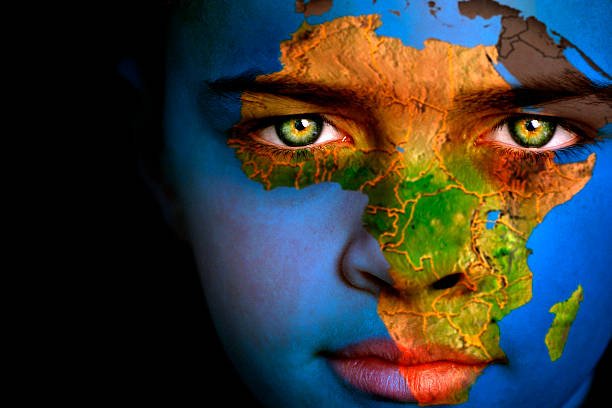 Earth boy - Africa Portrait of a boy with the map of Africa painted on his face africa map stock pictures, royalty-free photos & images