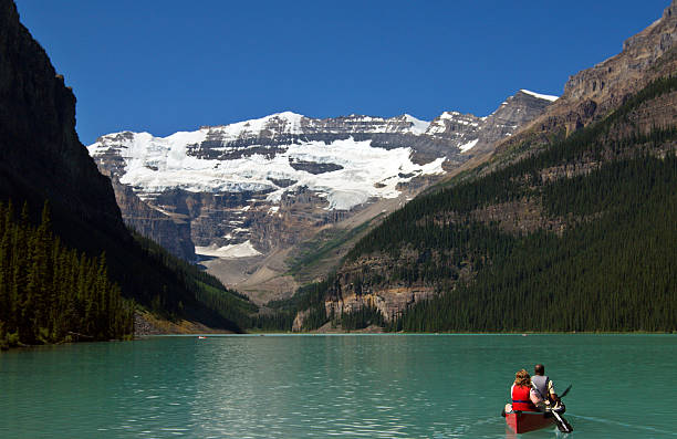istock Couple In Canoe Lake Louise Banff 157188183