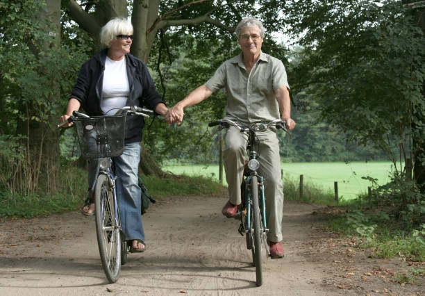 istock Senior couple cycling together 157188295