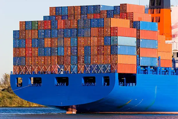 Blue container ship with a lot of containers 