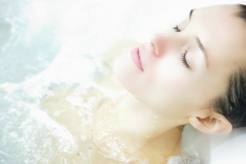 Beautiful woman dreaming in the spa.