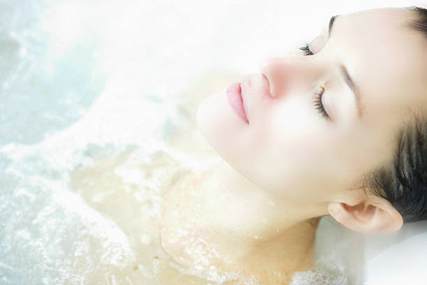 Spa dreams Beautiful woman dreaming in the spa. hydrotherapy stock pictures, royalty-free photos & images