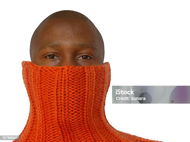 A Bald African Man Hides His Face In An Orange Sweater Stock Photo - Download Image Now