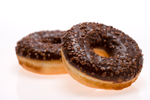 Doughnuts with chocolate topping on white background. In aRGB color for beautiful prints.