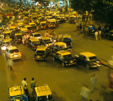 Mumbai, taxi, cabs, traffic, noise, pollution, welcome to Bombay. Yellow cabs at night. All number plates have been changed to non-existing ones.