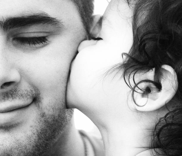 istock Child Kissing Her Father 157189192