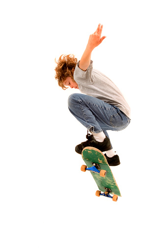 istock Young boy completing a skateboarding trick 157189342