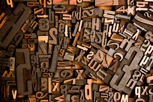A bunch of pieces of wood type. Makes a great background image. The two credit size would make a killer desktop background for any designer.