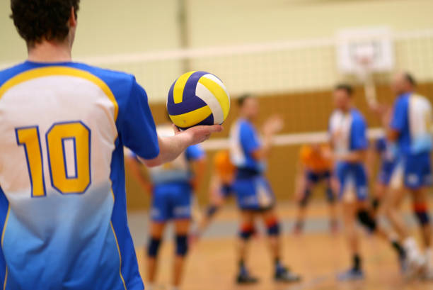 volleyball volleyball in the hand of a male player male volleyball player stock pictures, royalty-free photos & images