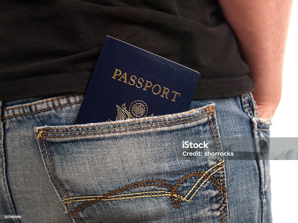 World Traveler Passport in man's back pocket -- ready to head out of the country for an adventure Pocket Stock Photo