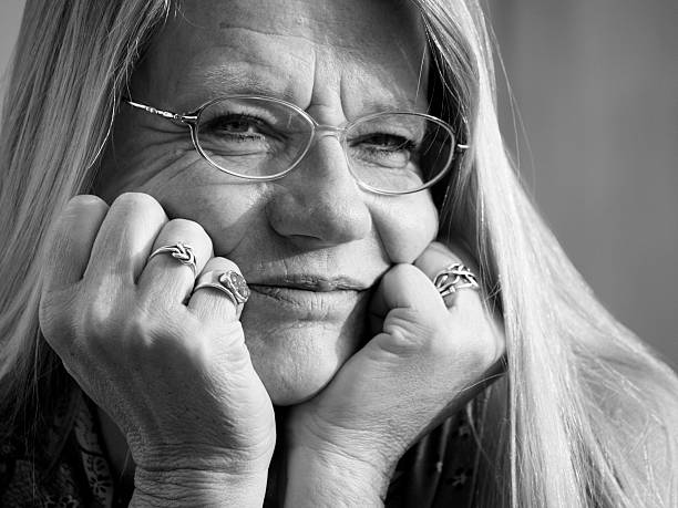 Woman in her sixties - being relaxed - but very alert.....