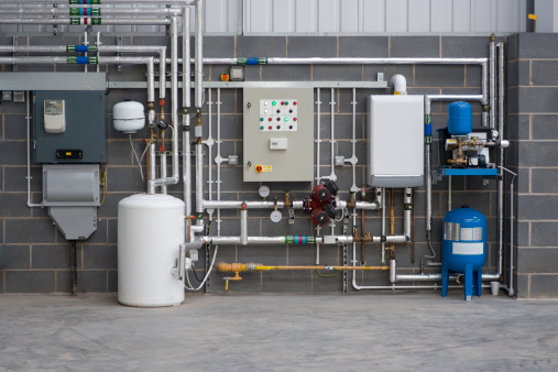Service utility area in newly built factory,control panel,gas bolier, water heater, electricity meter and mains water supply.