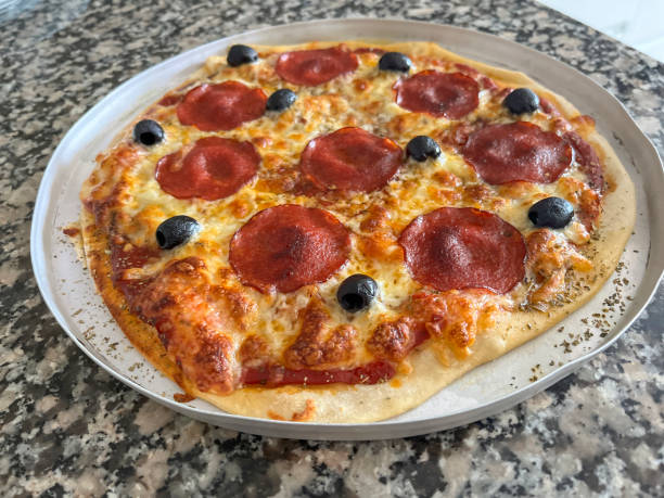 istock Homemade pizza fresh from oven 1571904042