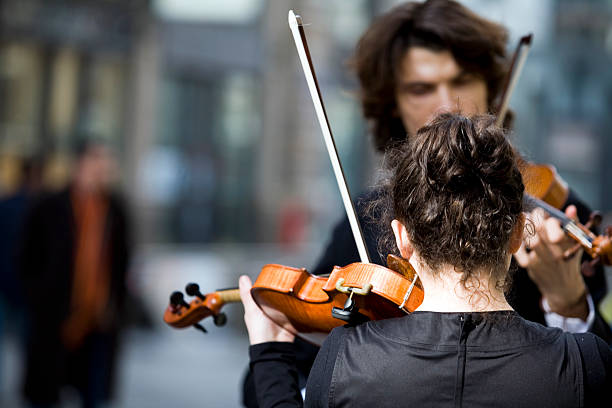 A street concerto with violins stock photo