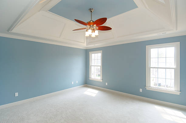istock A blue and white carpeted master bedroom 157190482