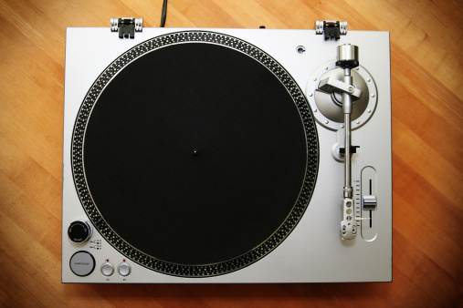 Chrome Turntable / Record Player on Wood Background
