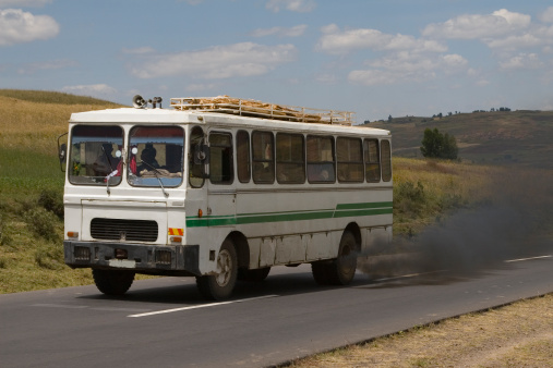 Smoking fumes from a bus in a landscape in Ethiopia along the road from Addis Ababa to Debre Lebanos.