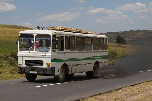 Ethiopian smoking public bus Smoking fumes from a bus in a landscape in Ethiopia along the road from Addis Ababa to Debre Lebanos. addis ababa ethiopia photos stock pictures, royalty-free photos & images