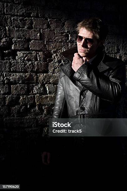 Hiding In The Shadows Stock Photo - Download Image Now - Men, Ominous, Sunglasses