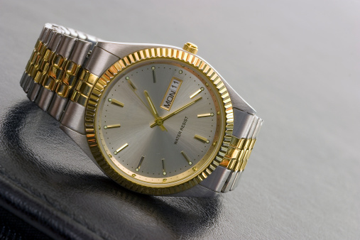A picture of a gold watch.