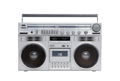 Retro boombox ghetto blaster , radio and audio tape recorder on wooden table. 3d illustration