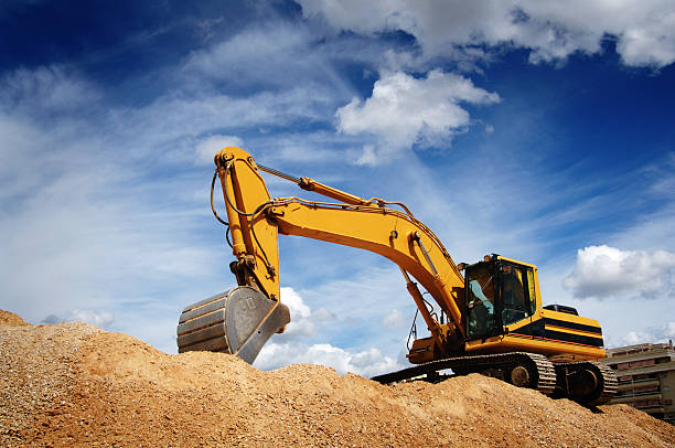 Bulldozer Excavator performing earthworks backhoe photos stock pictures, royalty-free photos & images