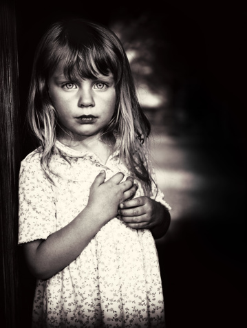 Portrait of a beautiful little girl in poverty.