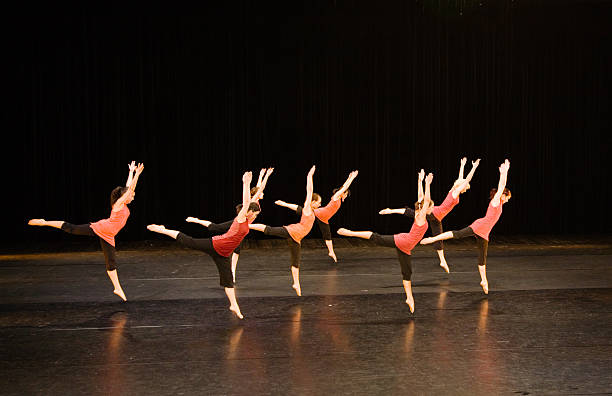 istock Group of contemporary dancers performing on stage 157191355