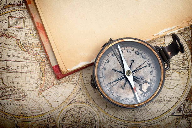 Compass Compass and old map equator line stock pictures, royalty-free photos & images