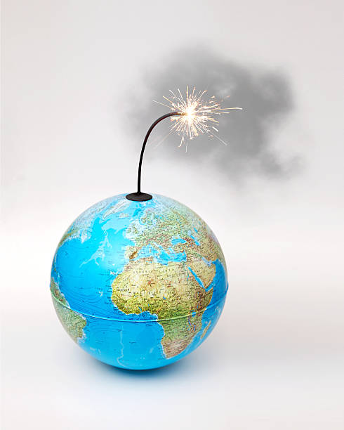 istock Globe bomb with smokey lit fuse on white background 157191431