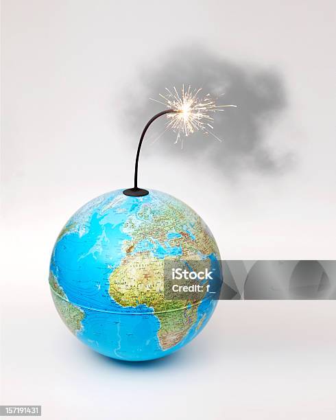 Globe Bomb With Smokey Lit Fuse On White Background Stock Photo - Download Image Now
