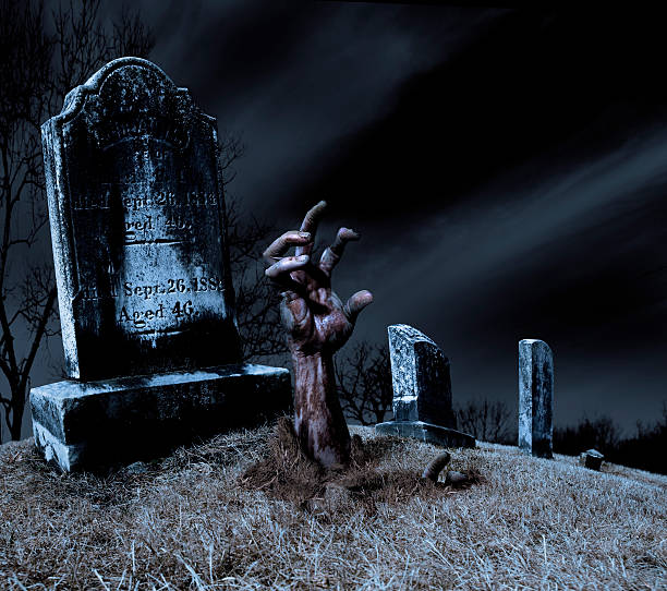 istock Zombie hand rising out of a grave 157191461