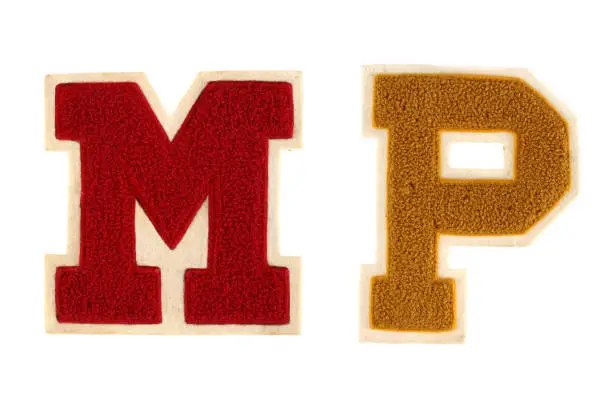 2 generic high school varsity letters.  These letters a fairly old and have a vintage/grungy look and feel.  Nice detail and isolated on white background.