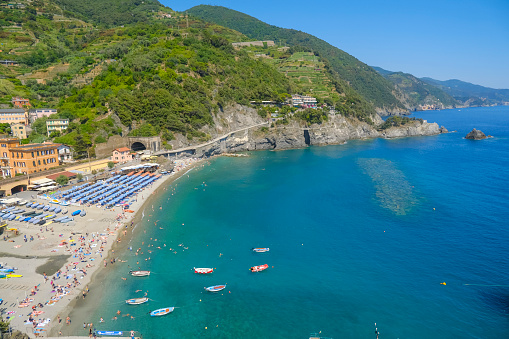 aerial view over beach chairs and umbrellas on the beach of Monterosso, Cinque Terre, The Ligurian Sea, Liguria, Italy, Italian Riviera
